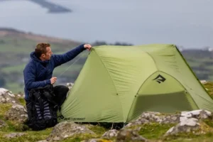 Two person tents pitched in a grassy UK campsite during a weekend trip
