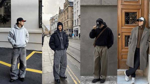 Man showing how to style a men’s hoodie with a jacket and joggers in an urban outfit